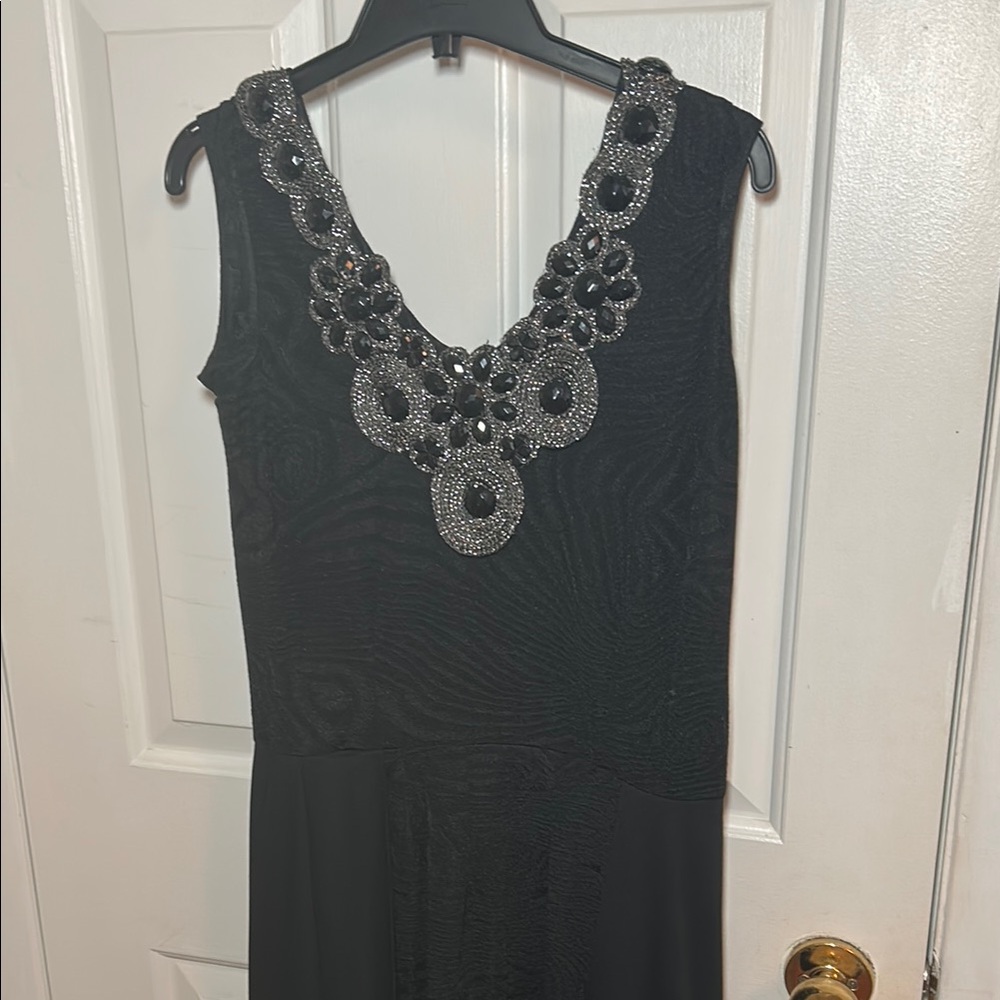 Elegant Black Sleeveless Dress with Embellished Neckline